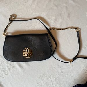Tory Burch black leather crossbody with gold accents.